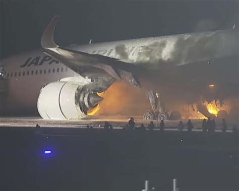 Plane catches fire on runway at Japan’s Haneda airport, passengers reportedly safe